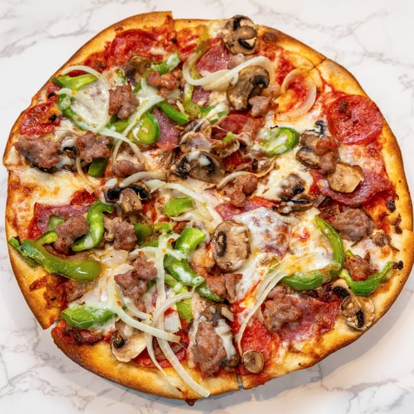 A DiCicco's Italian Restaurant pizza with pepperoni, sausage, mushrooms, green peppers, and onions.