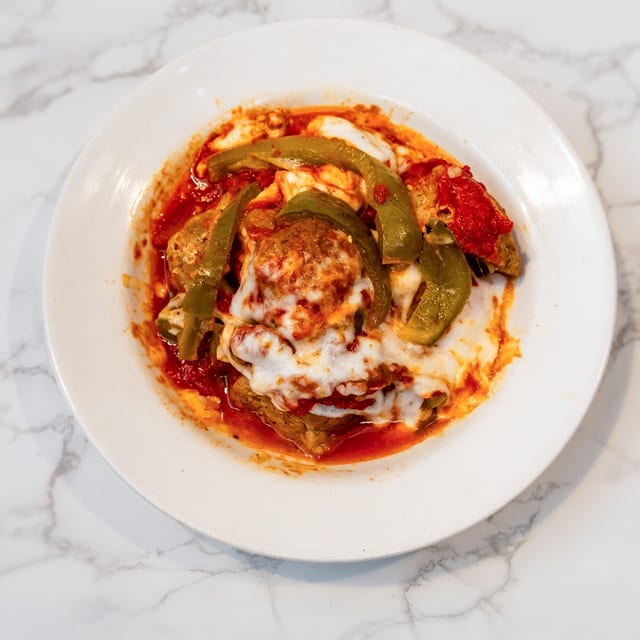 3 Meatballs with Peppers and Cheese.